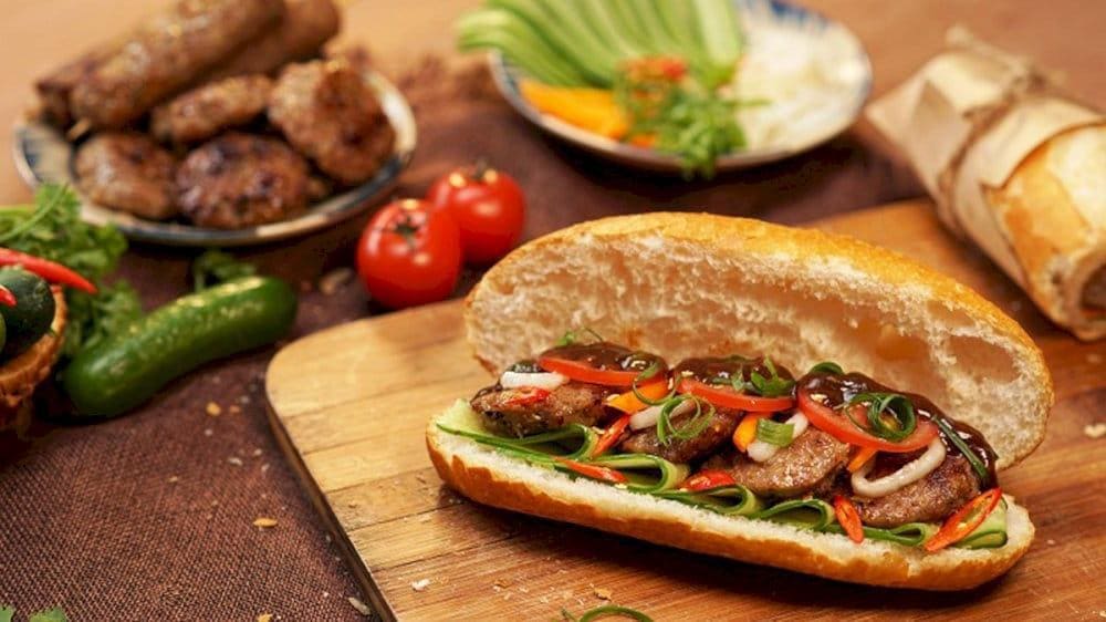 Their banh mi is served warm, packed with flavorful meat, and topped with fresh vegetables and herbs